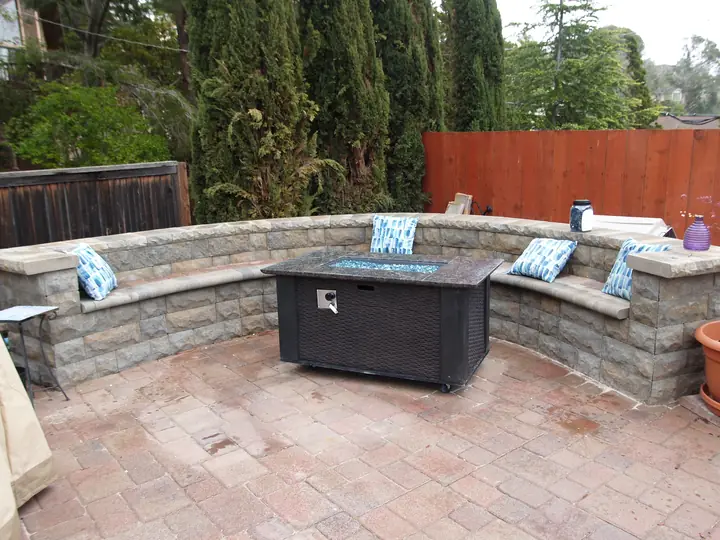 Fire Pit Masonry Curved Seat Wall And Fire Table On A Paver Patio