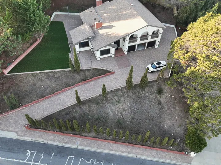 Hardscaping Aerial View Of A Paver Drive And Turf Lawn