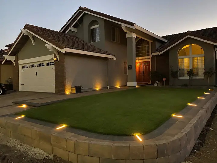 Landscape Lighting In Ground Uplights Along A Front Wall